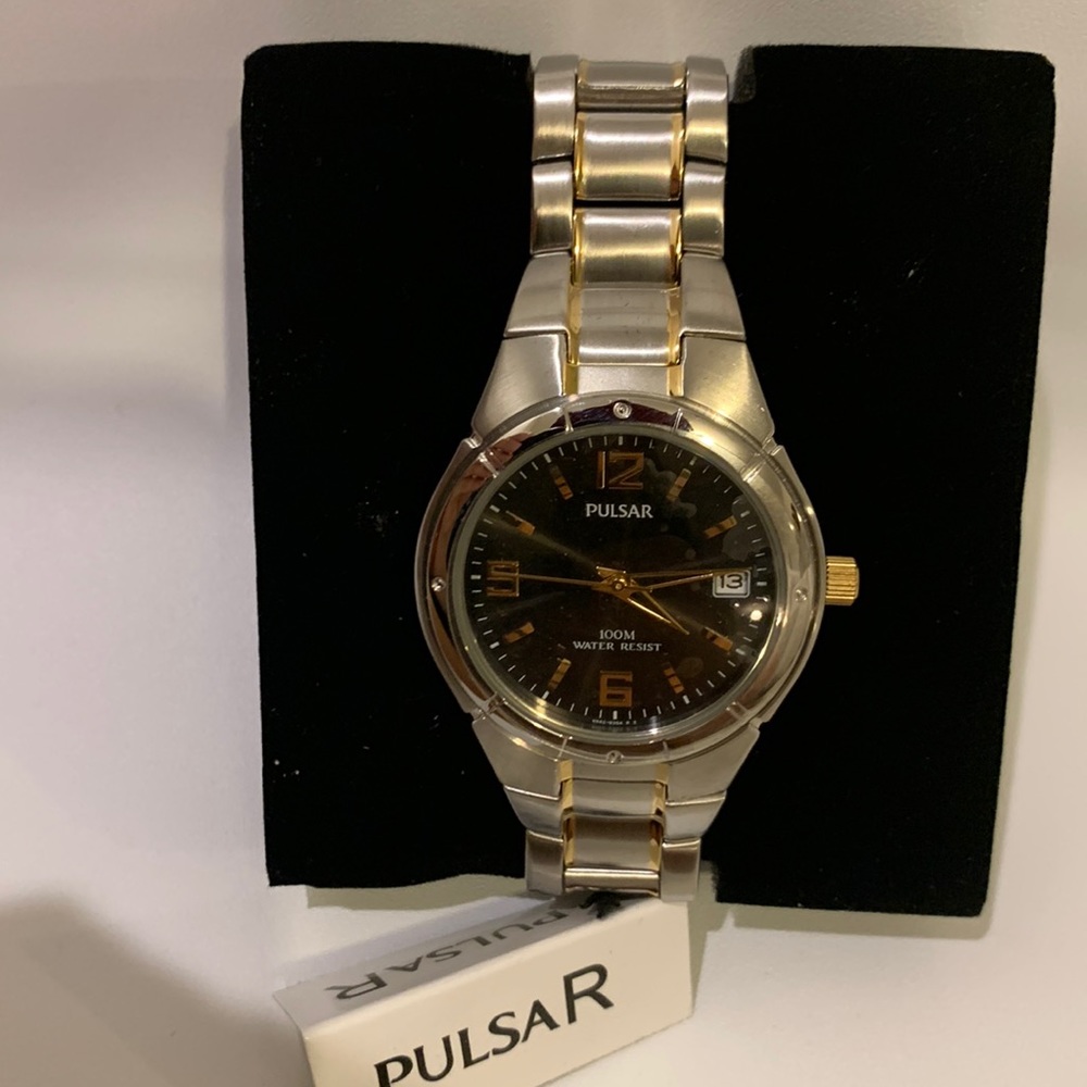 Large silver little gold black face watch